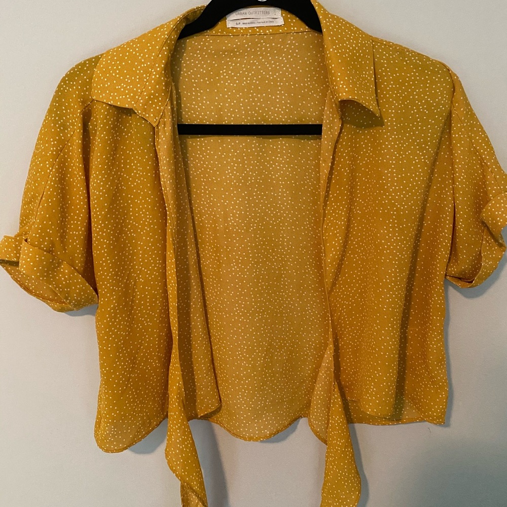 Yellow polka dotted tie front top.